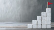 © CreativeIMGIdeas - Flag on Blocks: A minimalistic composition featuring a small red flag triumphantly planted atop a staircase of white blocks, symbolizing achievement and progress.