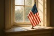 © Diclonius - A striking image of the United States flag stands proudly, bathed in natural light by a window. Capturing patriotism and national pride.
