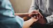 © peopleimages.com - Holding hands, trust and psychologist with patient, mental health and empathy for trauma or helping. Clinic, people and support for client with depression, consultation and therapist with sympathy