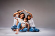 © StockImageFactory - Asian family making roof with hands to express love, safety, and real estate investment values