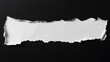 © MahmudulHassan - Torn edge of white paper piece displays rough texture against black background
