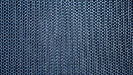 Poster - A textured metal surface features a series of circular perforations arranged in a grid pattern. Soft lighting enhances the depth and detail of the mesh, creating visual interest