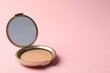© New Africa - Open face powder with mirror on pink background, closeup. Space for text