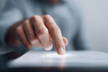 Poster - Closeup of a persons finger touching a tablet screen, symbolizing technology, connection, and digital interaction. Useful for illustrating concepts like innovation, business, or online services.