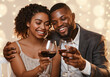 © Prostock-studio - Portrait of happy african couple celebrating St. Valentine's Day at restaurant, drinking red wine and embracing, close up