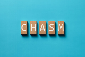Poster - There is wood block with the word CHASM. It is as an eye-catching image.