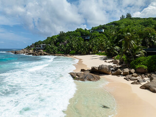  Beach with soft golden sand and azure water. Seychelles, Mahe. Anse Intendance beach.