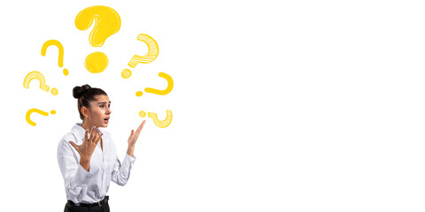 Fototapete - Confused businesswoman gesturing with hands surrounded by yellow question marks on white background, symbolizing curiosity and problem solving. 