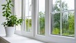 © Nashihal - Selective focus on condensation on PVC window and white plastic window with a houseplant in the background Concept of indoor plants and humidity