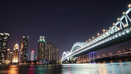 Aufkleber - Cityscape reflection bridge night illuminated water skyline modern scene with vibrant lights, river reflection and illuminated