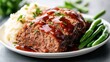© Larisa AI - Enjoy a hearty serving of meatloaf glazed with sauce, served alongside creamy mashed potatoes and green beans, reflecting home-cooked comfort and culinary satisfaction.