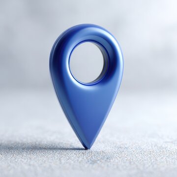 Blue glossy map marker on light gray surface