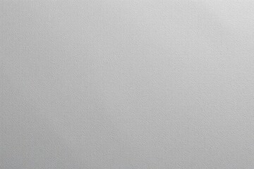 Textured gray surface with subtle grainy pattern and diffused lighting