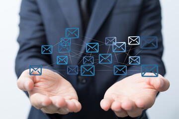 Poster - Businessman holding network of email icons.  Global communication, networking, and connection concept.