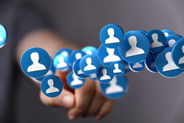 Poster - Abstract image of a hand interacting with digital profile icons, symbolizing networking and social connections.