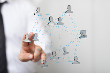 Leinwandbilder - Person touching a digital network of people, symbolizing teamwork and global connection.
