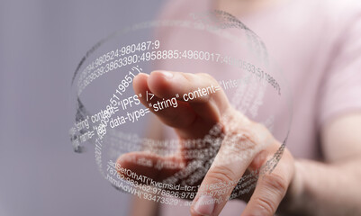 Poster - Hand interacting with a transparent digital sphere showing data and code.