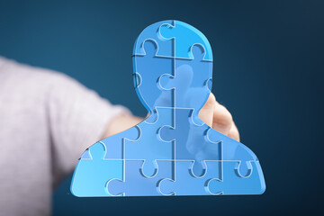 Aufkleber - Abstract image of a person made of puzzle pieces, symbolizing teamwork, collaboration, and connection.