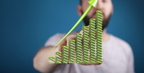 Aufkleber - Stock photo of a man showcasing an upward trending green bar graph, symbolizing growth and success in business.