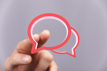 Aufkleber - Abstract image of a finger interacting with speech bubbles, representing communication, conversation, or dialogue.