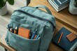 © SaroStock - Blue school backpack featuring a notebook, notepad, pen, and a bottle of sunscreen, equipment and tools inside its pockets, ready to go to school