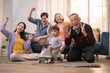 © Hip.hub - Family enjoys a joyful moment while celebrating together in their cozy living room with a child riding a toy