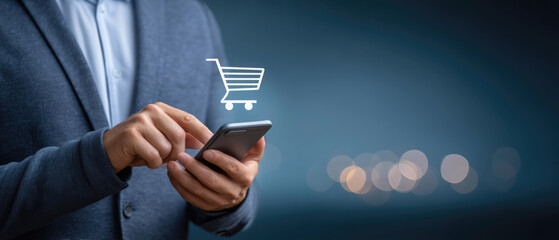Poster - Online shopping concept with man using smartphone and digital shopping cart icon on blurred background