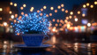 © Putu - Magical illuminated plant in a blue teacup on a table at night with blurred city lights in the background.