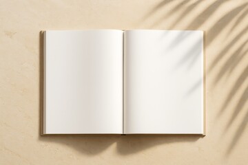 Poster - Open blank book on beige surface with sunlight and leaf shadows, minimal mockup for clean branding, design, or promotion concepts.