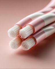 Leinwandbilder - High Bandwidth Optical Fiber Cable Ends with Visible Fiber Strands on Soft Pink Surface for Modern High-Speed Network Connectivity