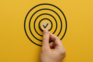Poster - Achieving precision and success this symbolizes focused effort and goal completion with a placing a marked token on a target center
