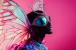 © Татьяна Евдокимова - Male model showcasing an extravagant butterfly costume and stylish glasses while posing against a vibrant pink background in the studio