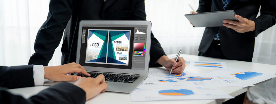Graphic designer software for modern design of web page and commercial brisk ads showing on the computer screen