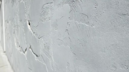 Poster - Abstract white wall texture with sunlight creating shadows and contrast for background use.