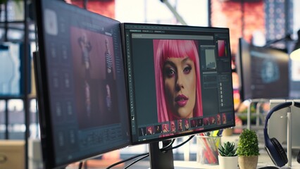 Poster - Organized creative workspace for graphic designers and photographers, featuring a dual monitor setup with digital editing tools. Photo editor software and AI chat bot for content creation.