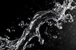 © Andiahmad - Water splash in motion against black background