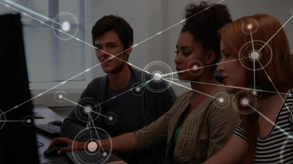Poster - Team at computers clicking mouse and visualizing network overlay to represent data flow in tech lab