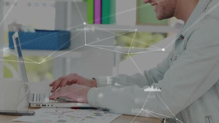 Poster - Male office worker typing on laptop driving network overlay growing over desk for tech data charts