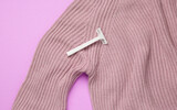 Disposable razor on a sweater, coil removal