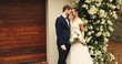 © Lime25/peopleimages.com - Wedding, celebration and couple with hug outdoor for marriage ceremony, milestone and romance. Relationship, happy people and event by home with commitment, promise and union of love with partnership