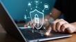 © mediastok.ai - A person interacts with a security interface displayed on a laptop.