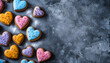 © Oleksiy - Tasty colourful heart shaped cookies on grey background