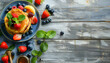 © Oleksiy - Delicious pancakes with berries, jam and honey on wooden table