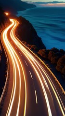 Poster - Experience the beauty of a coastal highway at night with stunning light trails and a breathtaking view