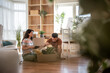 © Migma_Agency - Young couple unpacking boxes in new home after moving in