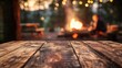 © yiam - Campfire at night with wooden table in foreground and blurred lights creating a cozy outdoor vibe