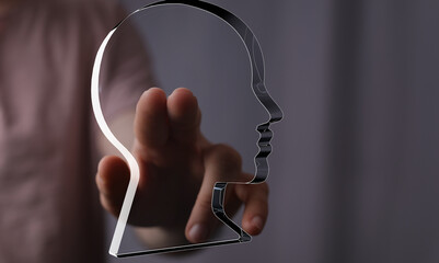 Leinwandbilder - Hand reaching towards a translucent head, symbolizing mental processes, ideas, and understanding.
