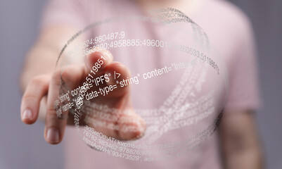 Aufkleber - Close-up of a hand interacting with a digital holographic display showing lines of code.