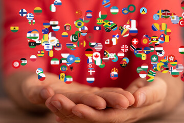 Poster - Image of hands gently cradling numerous flags, symbolizing global unity and connection.