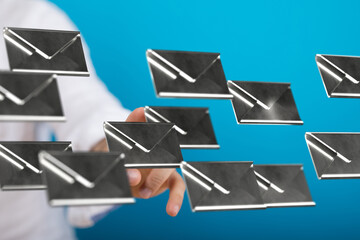 Poster - Hand interacting with digital email icons, symbolizing email management and inbox organization.